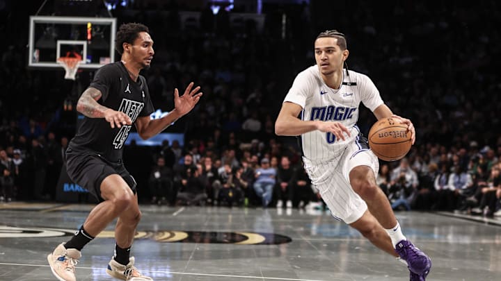 Nov 29, 2024; Brooklyn, New York, USA; Orlando Magic guard Anthony Black (0) looks to drive past Brooklyn Nets guard Keon Johnson (45) in the third quarter at Barclays Center. Mandatory Credit: Wendell Cruz-Imagn Images Nov 29, 2024; Brooklyn, New York, USA; Orlando Magic guard Anthony Black (0) looks to drive past Brooklyn Nets guard Keon Johnson (45) in the third quarter at Barclays Center. Mandatory Credit: Wendell Cruz-Imagn Images