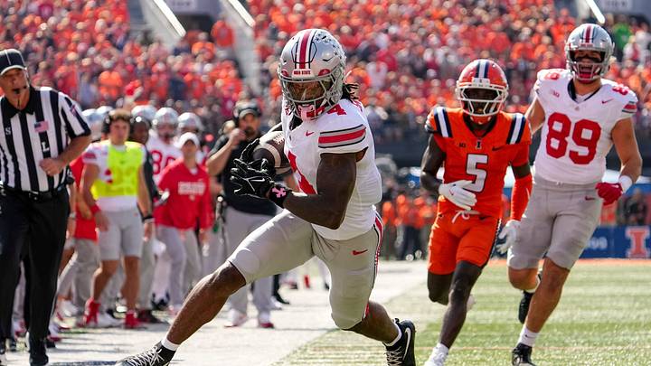 Ohio State receiver Jeremiah Smith runs with the ball against Illinois on Oct. 11.