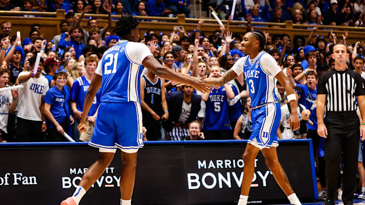 Oct 3, 2025; Durham, NC, USA; Duke Blue Devils center Patrick Ngongba II (21) and guard Isaiah Evans (3) celebrate during the Countdown to Craziness at the Cameron Indoor Stadium. 