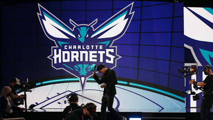 Jul 29, 2021; Brooklyn, New York, USA; James Bouknight (Connecticut) walks off the stage after being selected as the number eleven overall pick by the Charlotte Hornets in the first round of the 2021 NBA Draft at Barclays Center. Mandatory Credit: Brad Penner-USA TODAY Sports