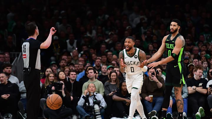 Dec 6, 2024; Boston, Massachusetts, USA; Milwaukee Bucks guard Damian Lillard (0) reacts after fouling Boston Celtics forward Jayson Tatum (0) during the second half at TD Garden. Mandatory Credit: Bob DeChiara-Imagn Images Dec 6, 2024; Boston, Massachusetts, USA; Milwaukee Bucks guard Damian Lillard (0) reacts after fouling Boston Celtics forward Jayson Tatum (0) during the second half at TD Garden. Mandatory Credit: Bob DeChiara-Imagn Images