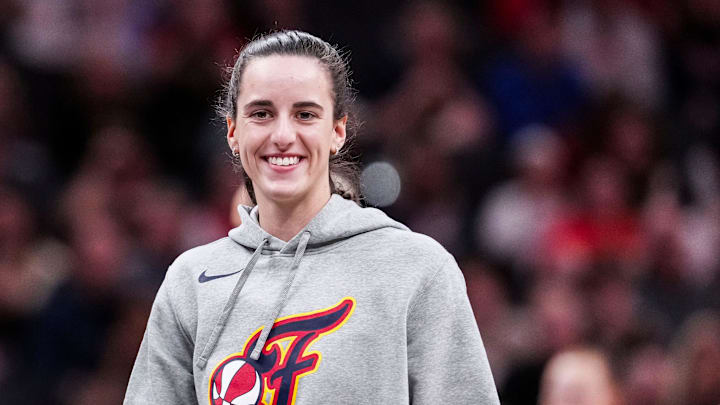 Indiana Fever Caitlin Clark (22) smiles Saturday, May 3, 2025, during a timeout at a preseason game between the Indiana Fever and the Washington Mystics at Gainbridge Fieldhouse in Indianapolis.