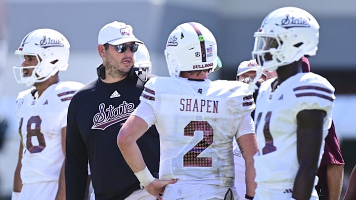 Sep 21, 2024; Starkville, Mississippi, USA; Mississippi State Bulldogs head coach Jeff Lebby speaks with quarterback Blake Shapen (2) during the fourth quarter against the Florida Gators at Davis Wade Stadium at Scott Field. Mandatory Credit: Matt Bush-Imagn Images