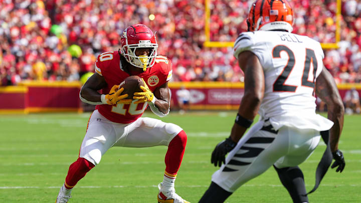 Sep 15, 2024; Kansas City, Missouri, USA; Kansas City Chiefs running back Isiah Pacheco (10) catches a pass against Cincinnati Bengals safety Vonn Bell (24) at GEHA Field at Arrowhead Stadium. Mandatory Credit: Jay Biggerstaff-Imagn Images