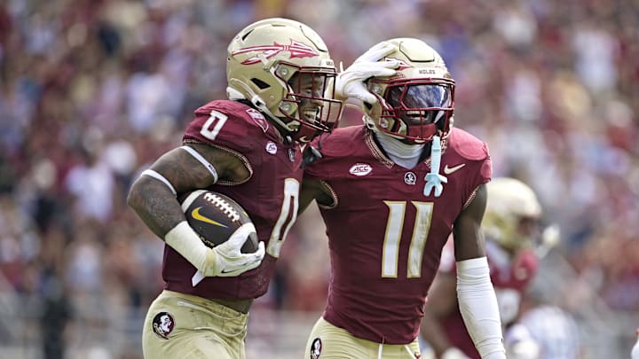 Oct 11, 2025; Tallahassee, Florida, USA; Florida State Seminoles safety Earl Little Jr. (0) and defensive back Ja'Bril Rawls (11) celebrate after an interception during the first half of the game against the Pittsburgh Panthers at Doak S. Campbell Stadium. Mandatory Credit: Melina Myers-Imagn Images