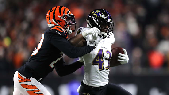 Jan 15, 2023; Cincinnati, Ohio, USA; Baltimore Ravens running back Justice Hill (43) is pushed out-of-bounds by Cincinnati Bengals cornerback Eli Apple (20) during the second half in a wild card game at Paycor Stadium. Mandatory Credit: Katie Stratman-Imagn Images Jan 15, 2023; Cincinnati, Ohio, USA; Baltimore Ravens running back Justice Hill (43) is pushed out-of-bounds by Cincinnati Bengals cornerback Eli Apple (20) during the second half in a wild card game at Paycor Stadium. Mandatory Credit: Katie Stratman-Imagn Images