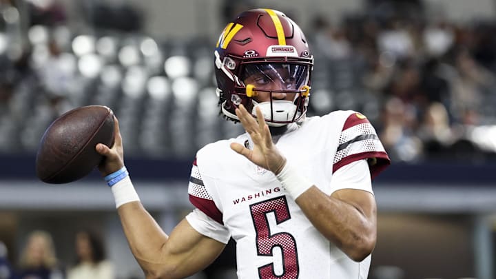 Jan 5, 2025; Arlington, Texas, USA;  Washington Commanders quarterback Jayden Daniels (5) warms up before the game against the Dallas Cowboys at AT&T Stadium. Mandatory Credit: Kevin Jairaj-Imagn Images