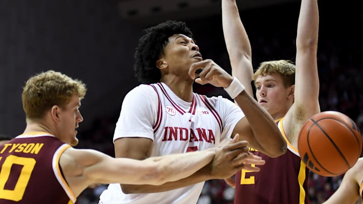 Mar 4, 2026; Bloomington, Indiana, USA; Minnesota Golden Gophers guard Cade Tyson (10) fouls Indiana Hoosiers forward Sam Alexis (4) during the first half at Simon Skjodt Assembly Hall.