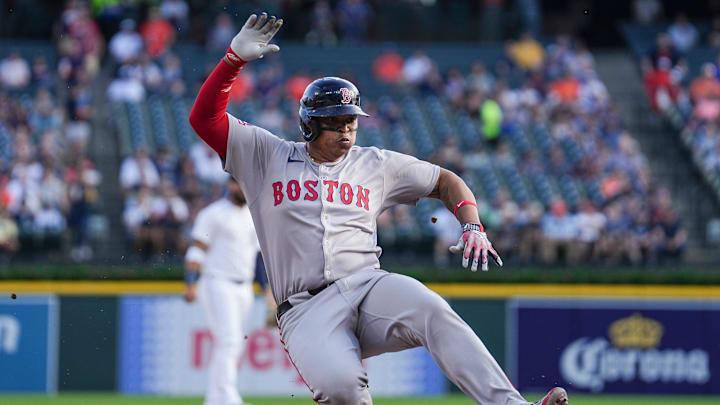 Boston Red Sox designated hitter Rafael Devers (11) slides into third base against Detroit Tigers during the first inning at Comerica Park in Detroit on Wednesday, May 14, 2025.