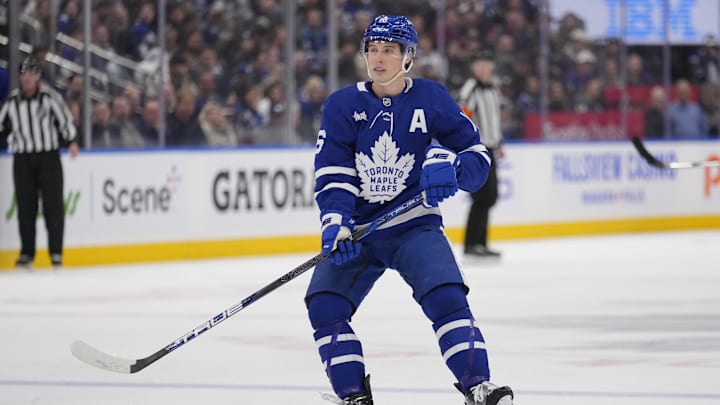 Jan 11, 2025; Toronto, Ontario, CAN; Toronto Maple Leafs forward Mitch Marner (16) skates against the Vancouver Canucks during the second period at Scotiabank Arena. Mandatory Credit: John E. Sokolowski-Imagn Images