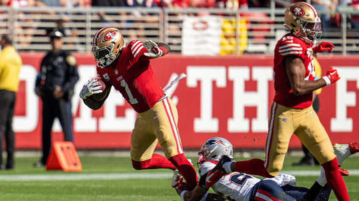 Sep 29, 2024; Santa Clara, California, USA; New England Patriots cornerback Marcus Jones (25) tackles San Francisco 49ers wide receiver Deebo Samuel Sr. (1) during the third quarter at Levi's Stadium. Mandatory Credit: Neville E. Guard-Imagn Images