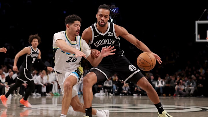 Jan 6, 2025; Brooklyn, New York, USA; Indiana Pacers guard Ben Sheppard (26) fights for the ball against Brooklyn Nets forward Tosan Evbuomwan (12) during the third quarter at Barclays Center. Mandatory Credit: Brad Penner-Imagn Images