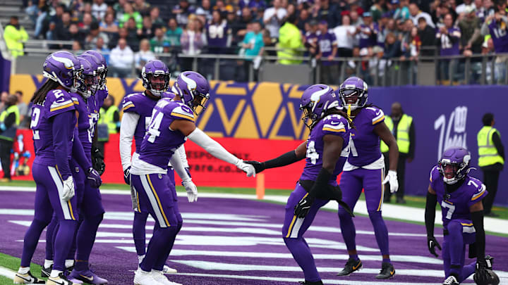 Oct 6, 2024; Tottenham, ENG; Minnesota Vikings Defensive Back Camryn Bynum (24) celebrates an interception with Defensive Back Josh Metellus (44) in the 2nd Quarter against New York Jets at Tottenham Hotspur Stadium. Mandatory Credit: Shaun Brooks-Imagn Images