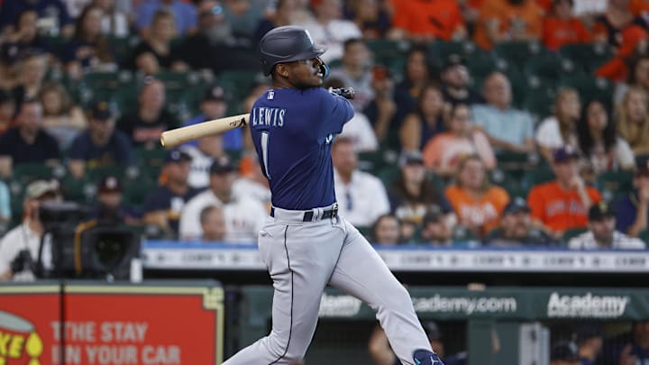 Jul 30, 2022; Houston, Texas, USA; Seattle Mariners designated hitter Kyle Lewis (1) hits a single during the first inning against the Houston Astros at Minute Maid Park. Mandatory Credit: Troy Taormina-Imagn Images