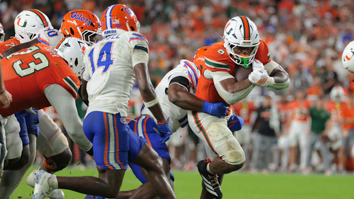 Sep 20, 2025; Miami Gardens, Florida, USA; Miami Hurricanes running back CharMar Brown (6) carries the football against the Florida Gators during the fourth quarter at Hard Rock Stadium. Mandatory Credit: Sam Navarro-Imagn Images