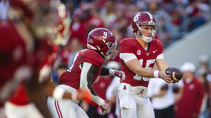 Nov 16, 2024; Tuscaloosa, Alabama, USA; Alabama Crimson Tide quarterback Ty Simpson (15) goes to pass off against the Mercer Bears during the fourth quarter at Bryant-Denny Stadium. Mandatory Credit: Will McLelland-Imagn Images