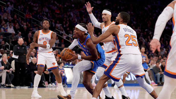 Jan 10, 2025; New York, New York, USA; Oklahoma City Thunder guard Shai Gilgeous-Alexander (2) drives to the basket against New York Knicks guard Josh Hart (3) and forward Mikal Bridges (25) during the first quarter at Madison Square Garden. Mandatory Credit: Brad Penner-Imagn Images