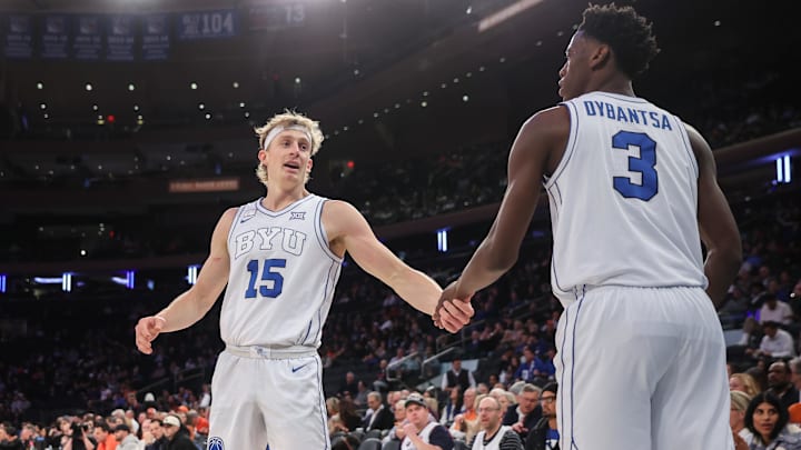 Dec 9, 2025; New York, New York, USA;  BYU Cougars guard Richie Saunders (15) and forward AJ Dybantsa (3) at Madison Square Garden. Mandatory Credit: Wendell Cruz-Imagn Images