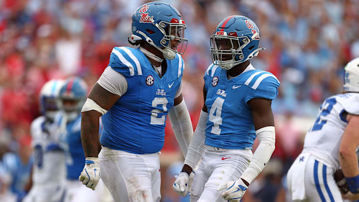 Sep 28, 2024; Oxford, Mississippi, USA; Mississippi Rebels defensive linemen Walter Nolen (2) and linebacker Suntarine Perkins (4) react after a sack during the second half against the Kentucky Wildcats at Vaught-Hemingway Stadium. Mandatory Credit: Petre Thomas-Imagn Images