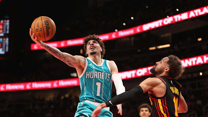 Mar 12, 2025; Atlanta, Georgia, USA; Charlotte Hornets guard LaMelo Ball (1) shoots against Atlanta Hawks guard Trae Young (11) during the second half at State Farm Arena. Mandatory Credit: Mady Mertens-Imagn Images Mar 12, 2025; Atlanta, Georgia, USA; Charlotte Hornets guard LaMelo Ball (1) shoots against Atlanta Hawks guard Trae Young (11) during the second half at State Farm Arena. Mandatory Credit: Mady Mertens-Imagn Images