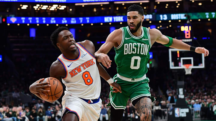 Feb 23, 2025; Boston, Massachusetts, USA;  New York Knicks forward OG Anunoby (8) drives to the basket while Boston Celtics forward Jayson Tatum (0) defends during the first half at TD Garden. Mandatory Credit: Bob DeChiara-Imagn Images