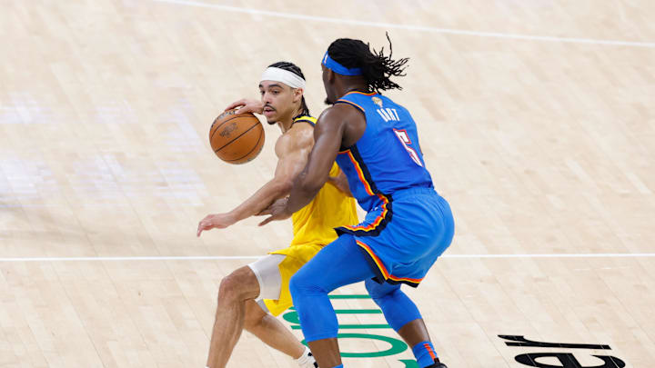 Jun 22, 2025; Oklahoma City, Oklahoma, USA; Indiana Pacers guard Andrew Nembhard (2) dribbles the ball against Oklahoma City Thunder guard Luguentz Dort (5) during the second half of game seven of the 2025 NBA Finals at Paycom Center. Mandatory Credit: Alonzo Adams-Imagn Images