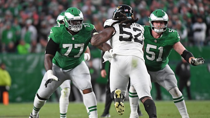 Nov 3, 2024; Philadelphia, Pennsylvania, USA; Philadelphia Eagles offensive tackle Mekhi Becton (77) and center Cam Jurgens (51) block Jacksonville Jaguars defensive tackle DaVon Hamilton (52) at Lincoln Financial Field. Mandatory Credit: Eric Hartline-Imagn Images