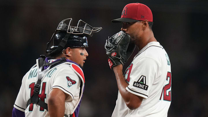 Arizona Diamondbacks pitcher Joe Ross (22) talks to catcher Gabriel Moreno (14) during their game against the Detroit Tigers at Chase Field on March 30, 2026.