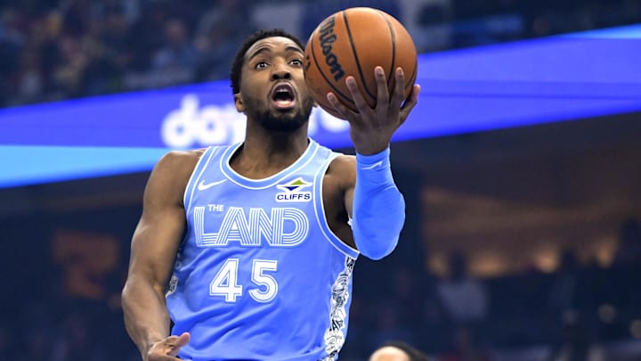 Mar 27, 2025; Cleveland, Ohio, USA; Cleveland Cavaliers guard Donovan Mitchell (45) drives to the basket in the first quarter against the San Antonio Spurs at Rocket Arena. Mandatory Credit: David Richard-Imagn Images