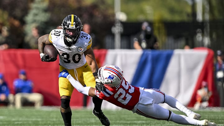 New England Patriots cornerback Marcus Jones attempts to tackle Pittsburgh Steelers running back Jaylen Warren. New England Patriots cornerback Marcus Jones attempts to tackle Pittsburgh Steelers running back Jaylen Warren.