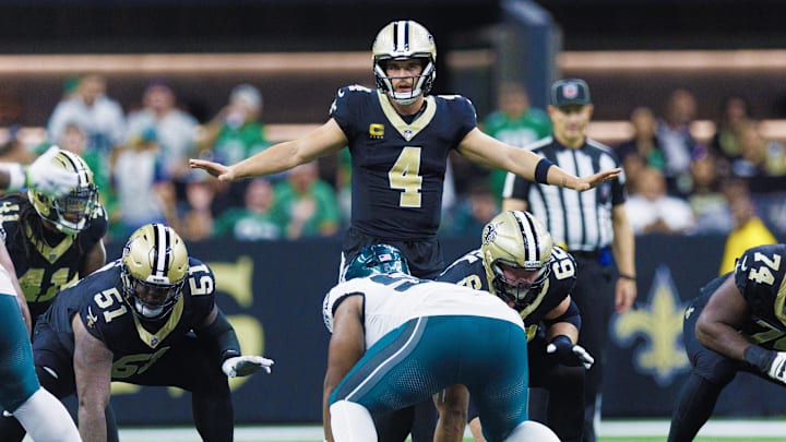 Sep 22, 2024; New Orleans, Louisiana, USA; New Orleans Saints quarterback Derek Carr (4) calls a play at the line against the Philadelphia Eagles during the second half at Caesars Superdome. Mandatory Credit: Stephen Lew-Imagn Images