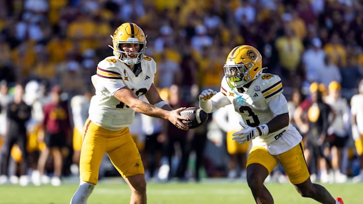 Oct 18, 2025; Tempe, Arizona, USA; Arizona State Sun Devils quarterback Sam Leavitt (10) hands off the ball to running back Raleek Brown (3) against the Texas Tech Red Raiders at Mountain America Stadium. Mandatory Credit: Mark J. Rebilas-Imagn Images Oct 18, 2025; Tempe, Arizona, USA; Arizona State Sun Devils quarterback Sam Leavitt (10) hands off the ball to running back Raleek Brown (3) against the Texas Tech Red Raiders at Mountain America Stadium. Mandatory Credit: Mark J. Rebilas-Imagn Images