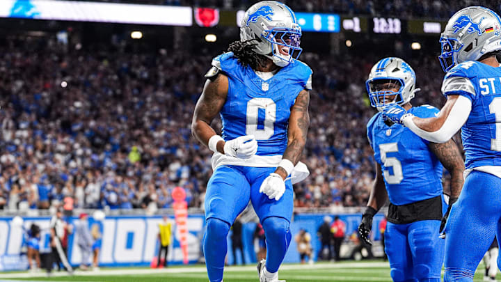 Lions running back Jahmyr Gibbs (0) celebrates a touchdown against Bears 