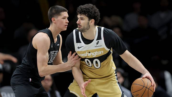 Feb 7, 2026; Brooklyn, New York, USA; Washington Wizards forward Tristan Vukcevic (00) controls the ball against Brooklyn Nets guard Egor Demin (8) during the third quarter at Barclays Center. Mandatory Credit: Brad Penner-Imagn Images