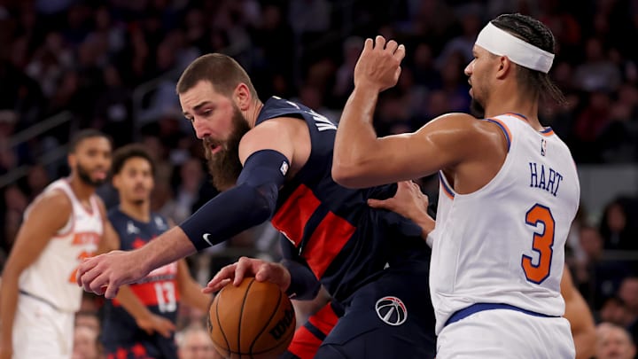 Nov 18, 2024; New York, New York, USA; Washington Wizards center Jonas Valanciunas (17) controls the ball against New York Knicks guard Josh Hart (3) during the second quarter at Madison Square Garden. Mandatory Credit: Brad Penner-Imagn Images