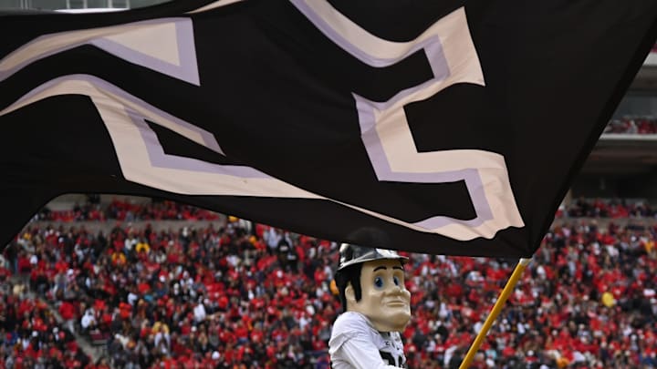 Purdue Boilermakers mascot Pete waves the school flag 