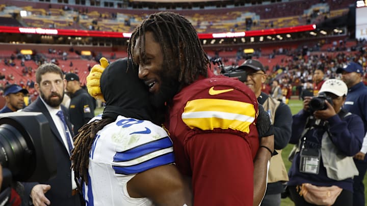 Nov 24, 2024; Landover, Maryland, USA; Dallas Cowboys wide receiver KaVontae Turpin (9) hugs Washington Commanders linebacker Dante Fowler Jr. (6) after their game at Northwest Stadium. Mandatory Credit: Geoff Burke-Imagn Images