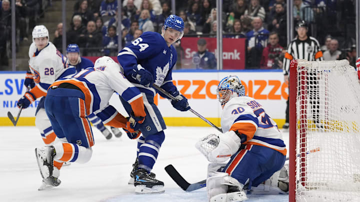 Dec 21, 2024; Toronto, Ontario, CAN; New York Islanders goaltender Ilya Sorokin (30) makes a save against Toronto Maple Leafs forward David Kampf (64) during the third period at Scotiabank Arena. Mandatory Credit: John E. Sokolowski-Imagn Images