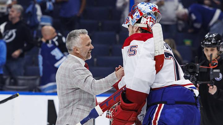 May 3, 2026; Tampa, Florida, USA; the Montreal Canadiens head coach Martin St. Louis and goalie Jakub Dobes (75) react to beating the Tampa Bay Lightning in game seven of the first round of the 2026 Stanley Cup Playoffs at Benchmark International Arena. Mandatory Credit: Morgan Tencza-Imagn Images