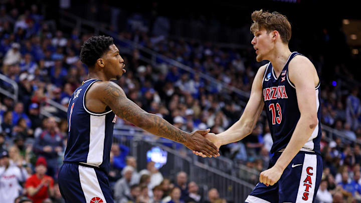 Mar 27, 2025; Newark, NJ, USA; Arizona Wildcats guard Caleb Love (1) and forward Henri Veesaar (13) celebrates during the first half against the Duke Blue Devils during an East Regional semifinal of the 2025 NCAA tournament at Prudential Center. Mandatory Credit: Vincent Carchietta-Imagn Images