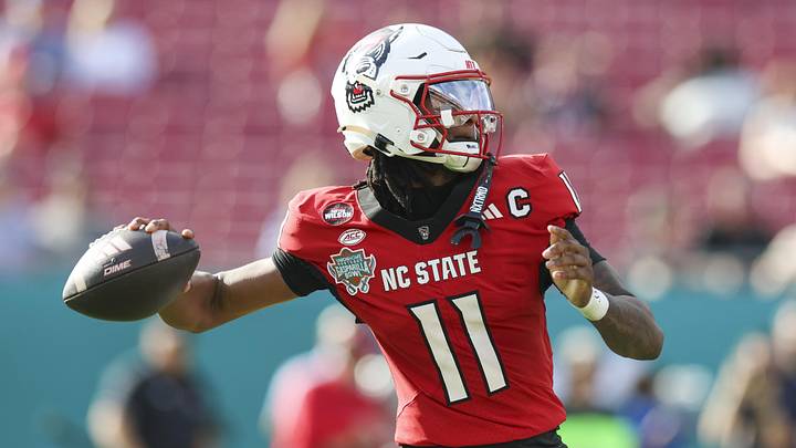 Dec 19, 2025; Tampa, FL, USA; NC State Wolfpack quarterback CJ Bailey (11) throws a pass against the Memphis Tigers in the first quarter during the Gasparilla Bowl at Raymond James Stadium. Mandatory Credit: Nathan Ray Seebeck-Imagn Images