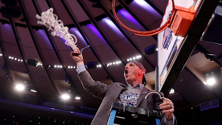 Mar 16, 2024; New York City, NY, USA; Connecticut Huskies head coach Dan Hurley cuts down the net