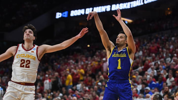 South Dakota State's guard Matt Mims (1) shoots the ball from the three point line during the second half on Thursday, March 21, 2024 at the CHI Health Center in Omaha, Nebraska.