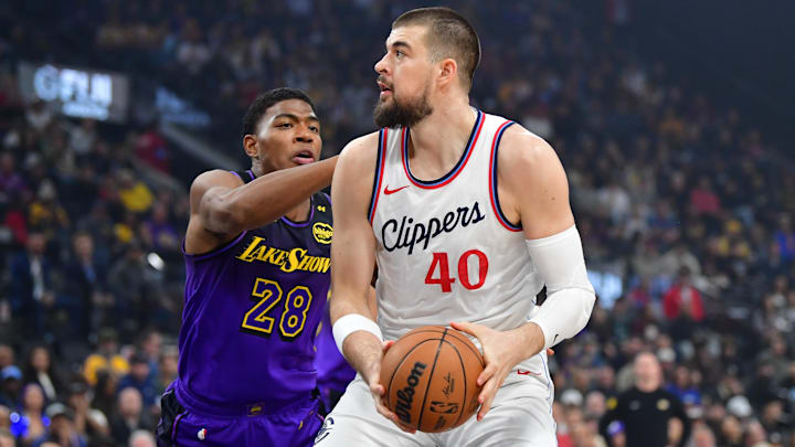 Jan 19, 2025; Inglewood, California, USA;  Los Angeles Clippers center Ivica Zubac (40) moves the ball against Los Angeles Lakers forward Rui Hachimura (28) during the first half at Intuit Dome. Mandatory Credit: Gary A. Vasquez-Imagn Images