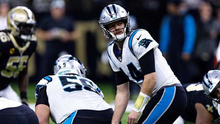 Jan 8, 2023; New Orleans, Louisiana, USA;  Carolina Panthers quarterback Sam Darnold (14) drops back to pass against the New Orleans Saints during the first half at Caesars Superdome. Mandatory Credit: Stephen Lew-Imagn Images