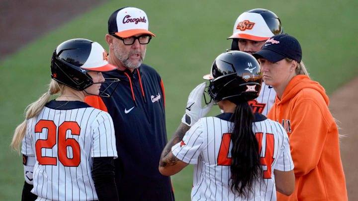 Oklahoma State coach Kenny Gajewski and assistant Vanessa Shippy-Fletcher talk with Oklahoma State infielder Rosie Davis (26) and infielder Tallen Edwards (44) during an NCAA softball game between the Oklahoma State University Cowgirls (OSU) and the Utah Utes in Stillwater, Okla., Friday, May 2, 2025. Oklahoma State coach Kenny Gajewski and assistant Vanessa Shippy-Fletcher talk with Oklahoma State infielder Rosie Davis (26) and infielder Tallen Edwards (44) during an NCAA softball game between the Oklahoma State University Cowgirls (OSU) and the Utah Utes in Stillwater, Okla., Friday, May 2, 2025.