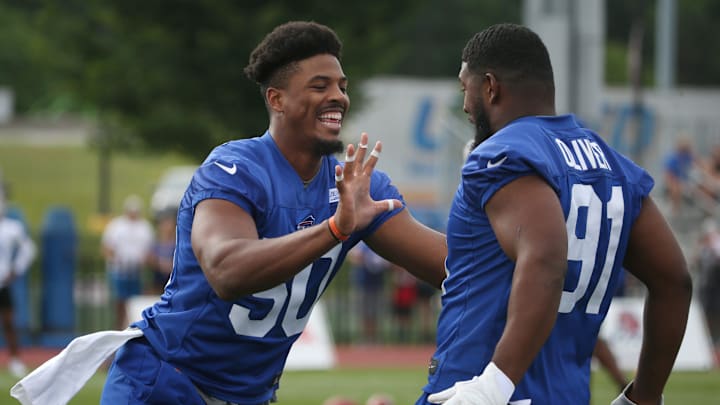 Defensive linemen Greg Rousseau, (50), left, and Ed Oliver, (91), right, joke around on the opening day of the Buffalo Bills training camp at St. John Fisher University in Rochester Sunday, July 24, 2022