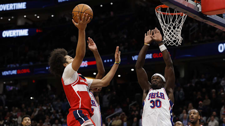Oct 28, 2025; Washington, District of Columbia, USA; Washington Wizards forward Kyshawn George (18) shoots the ball as Philadelphia 76ers center Adem Bona (30) and 76ers guard VJ Edgecombe (77) defend in overtime at Capital One Arena. Mandatory Credit: Geoff Burke-Imagn Images Oct 28, 2025; Washington, District of Columbia, USA; Washington Wizards forward Kyshawn George (18) shoots the ball as Philadelphia 76ers center Adem Bona (30) and 76ers guard VJ Edgecombe (77) defend in overtime at Capital One Arena. Mandatory Credit: Geoff Burke-Imagn Images