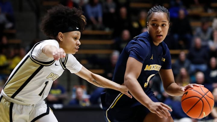Purdue Boilermakers guard Jordyn Poole (10) defends Michigan Wolverines guard Mila Holloway (3) Saturday, Jan. 11, 2025, during the NCAA women’s basketball game at Mackey Arena in West Lafayette, Ind. Michigan won 87-60.