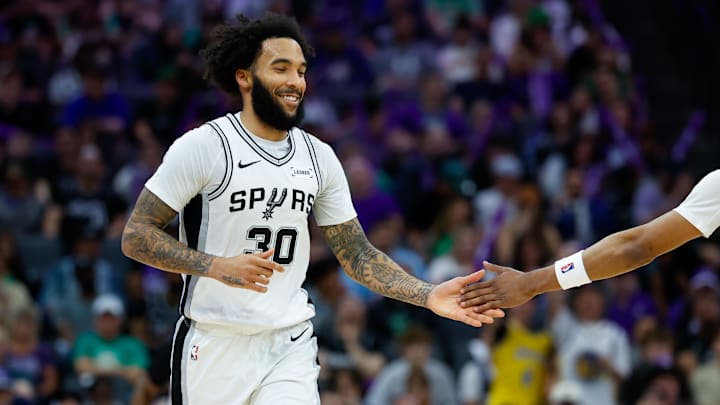 Mar 17, 2026; Sacramento, California, USA; San Antonio Spurs forward Julian Champagnie (30) celebrates after scoring during the third quarter against the Sacramento Kings at Golden 1 Center. Mandatory Credit: Sergio Estrada-Imagn Images